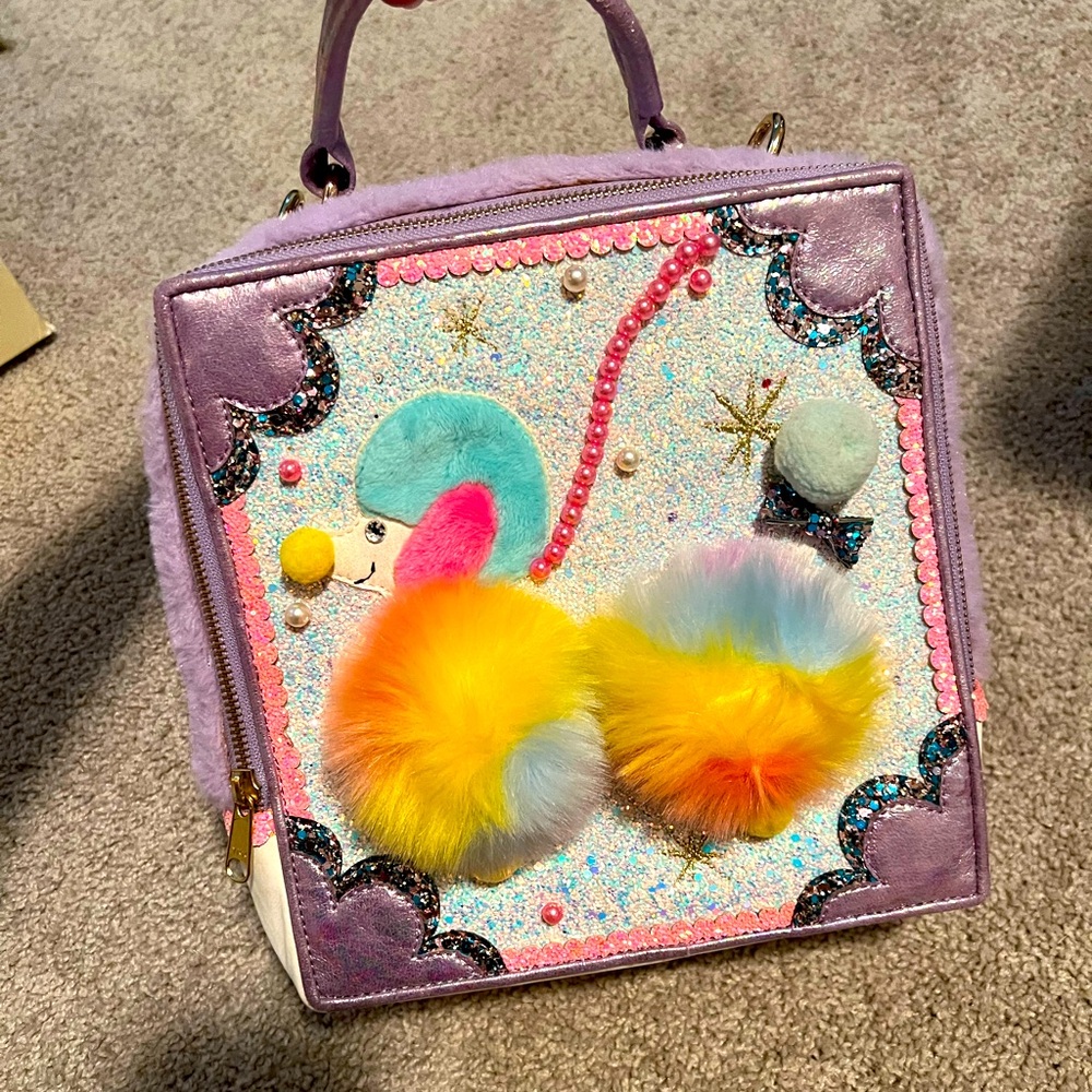 Irregular Choice Lavender Crossbody with Rainbow Pom-Pom Poodle Design